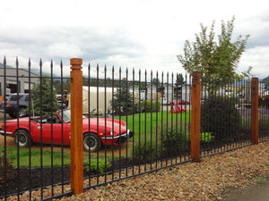 garden with a vintage red car at an auto recycler 
