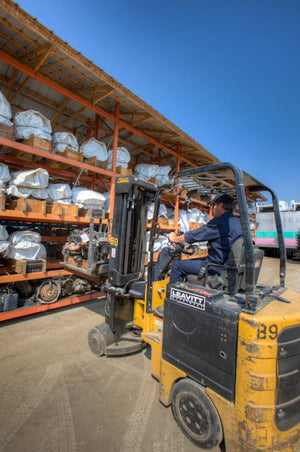 Leavitt forklift moving auto parts at an auto recycler